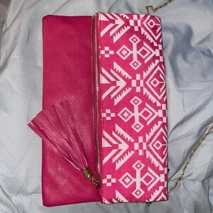 Pink clutch with metal strap